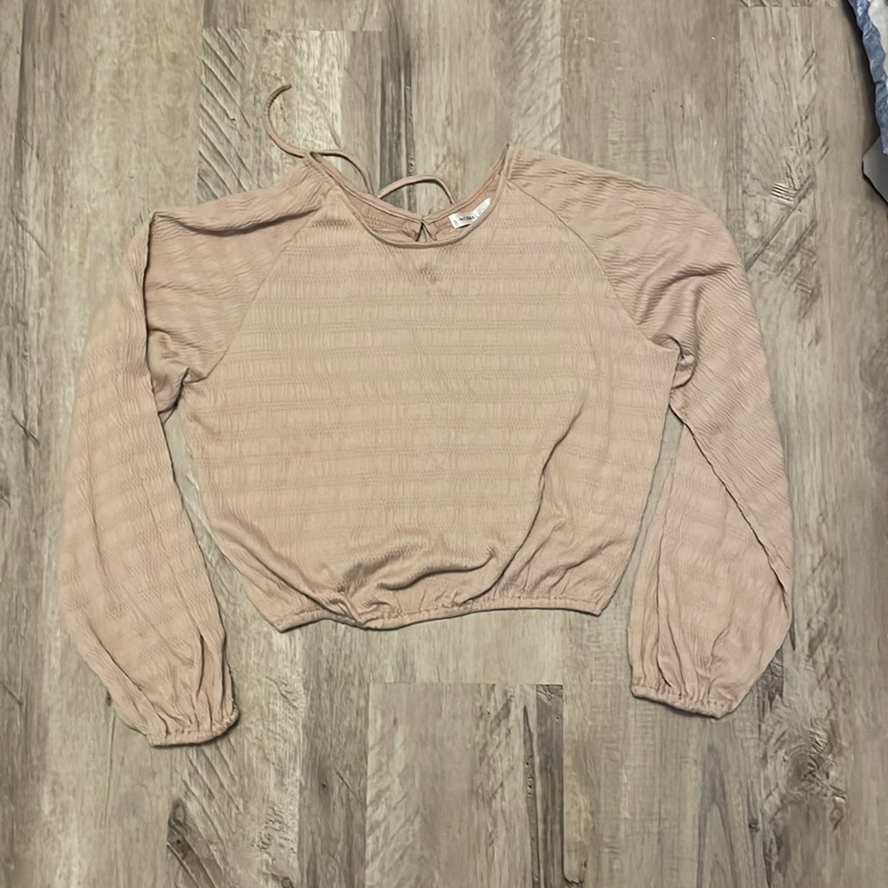 This is a later 2000’s long sleeved crop top.